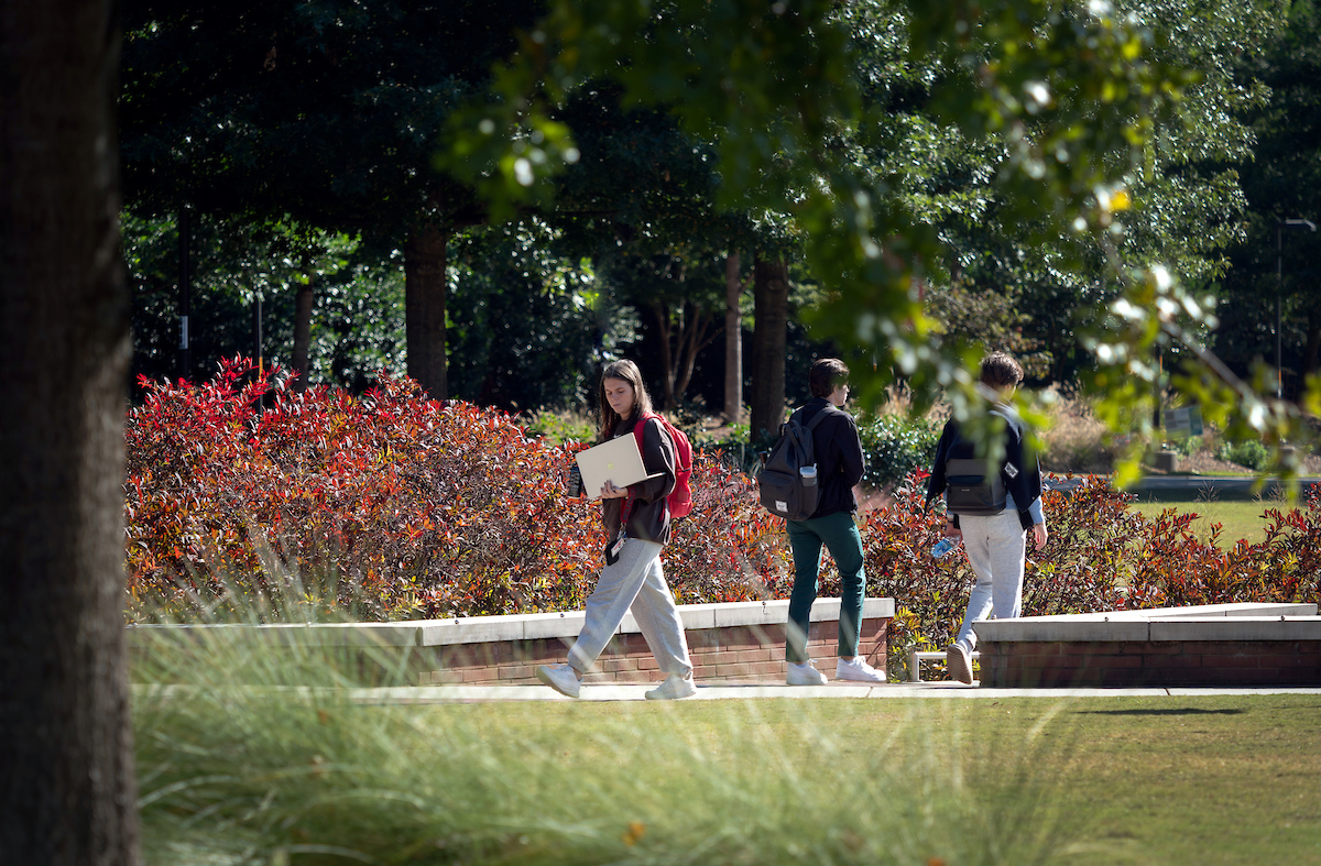 Students walk past Stafford Commons and the Talley Student Union on their way to and from class on a fall afternoon. Photo by Becky Kirkland.