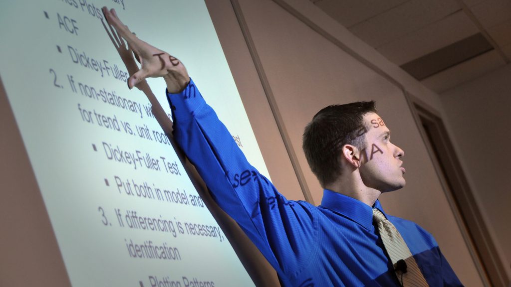 Faculty member giving PowerPoint presentation