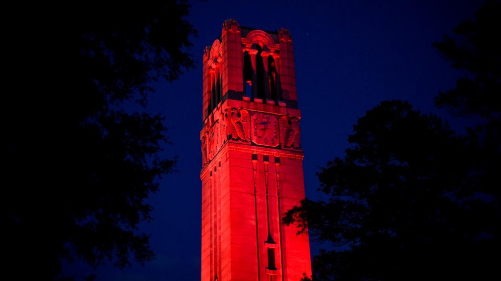Memorial Belltower lit red at night