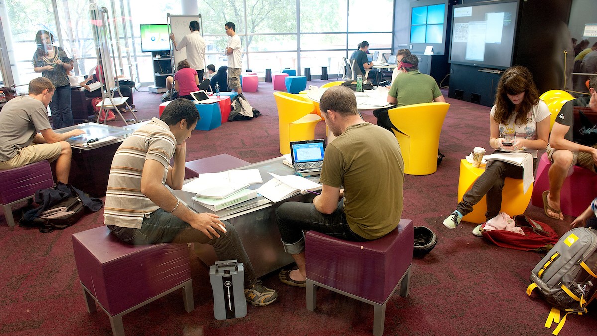 Students sitting on chairs in the D.H. Hill Library