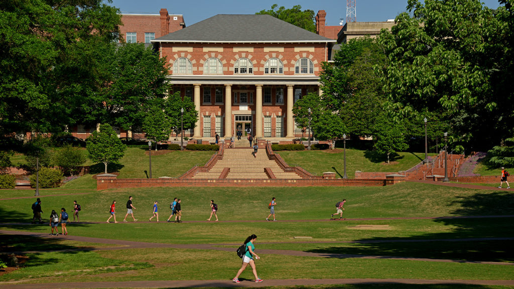 Students head cross the Court of North Carolina, heading to classes on North Campus.