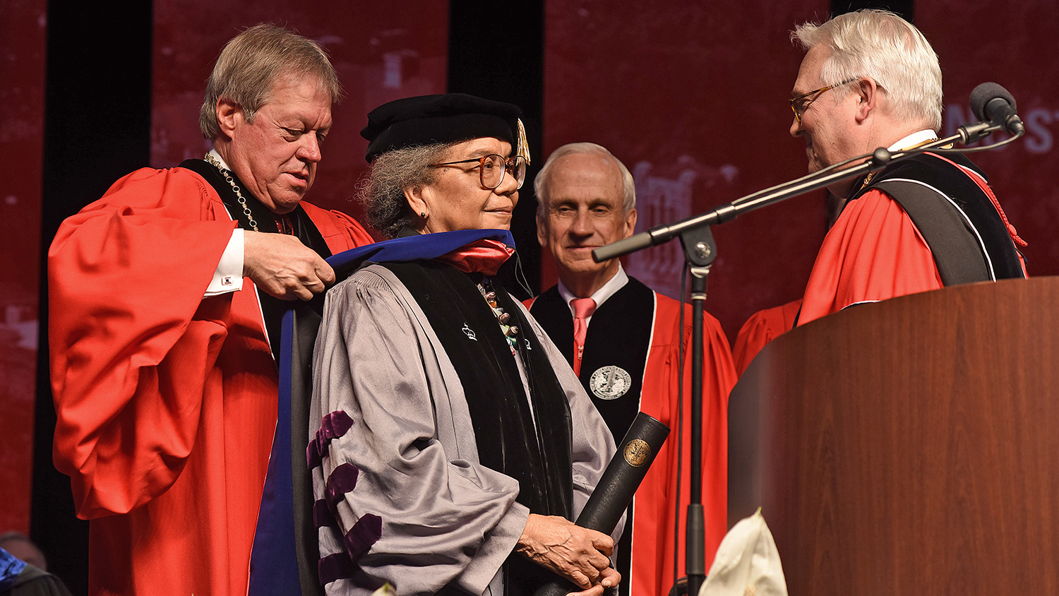 Board of Trusteess chair Jimmy Clark honors Marian Wright Edelman with an honorary doctorate.