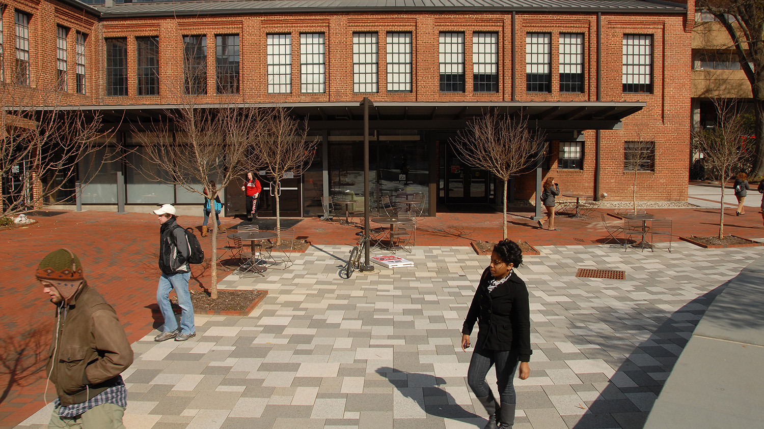 Students walk past Park Shops on a cold Winter day