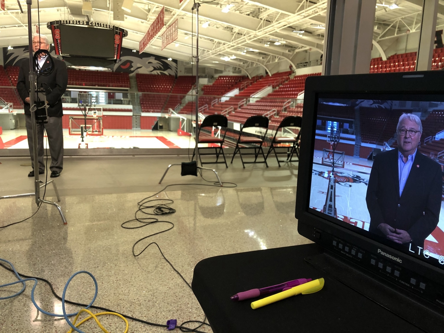 A camera crew records Chancellor Randy Woodson's remarks in Reynolds Coliseum, where Convocation normally takes place.