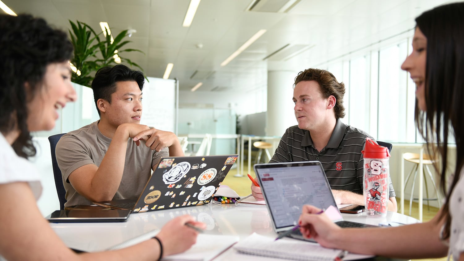 Students work together in the James B. Hunt Jr. Library. NC State's libraries provide spaces for interdisciplinary programs and collaboration.