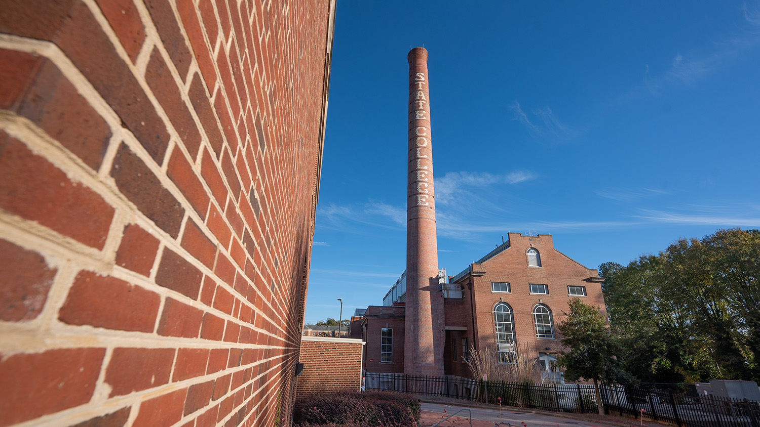 The Yarbrough Drive Steam Plant and Smokestack on a warm fall day