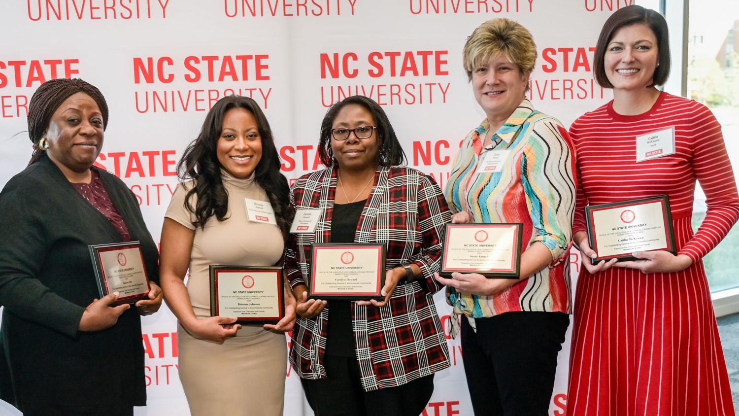 The five winners of the 2024 Provost's Unit Award for Excellence holding their award plaques.