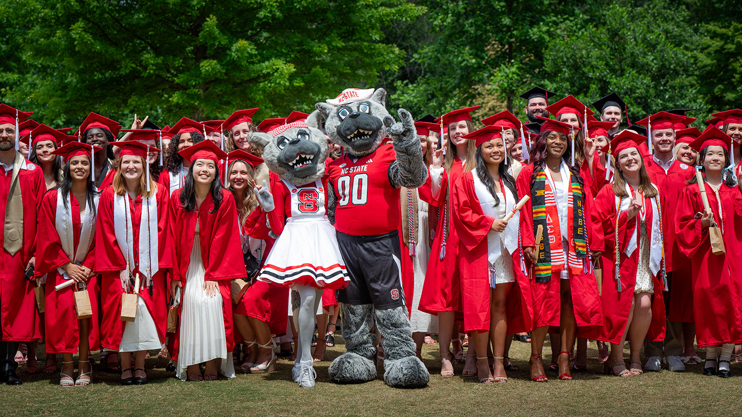 Mr. and Ms. Wuf with spring 2024 graduates