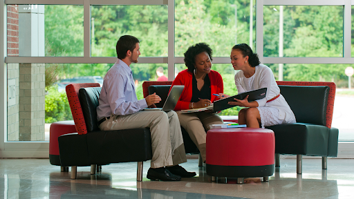 colleagues talking in the library