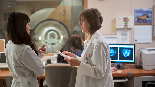 scientists talking in a lab