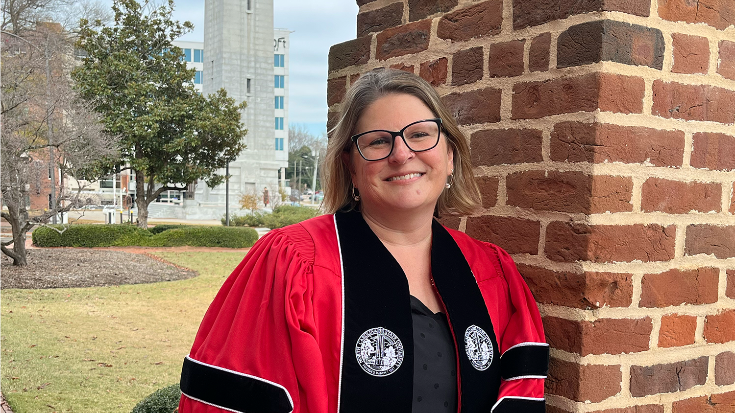 Graduate student Beth Shaver in her NC State cap and gown