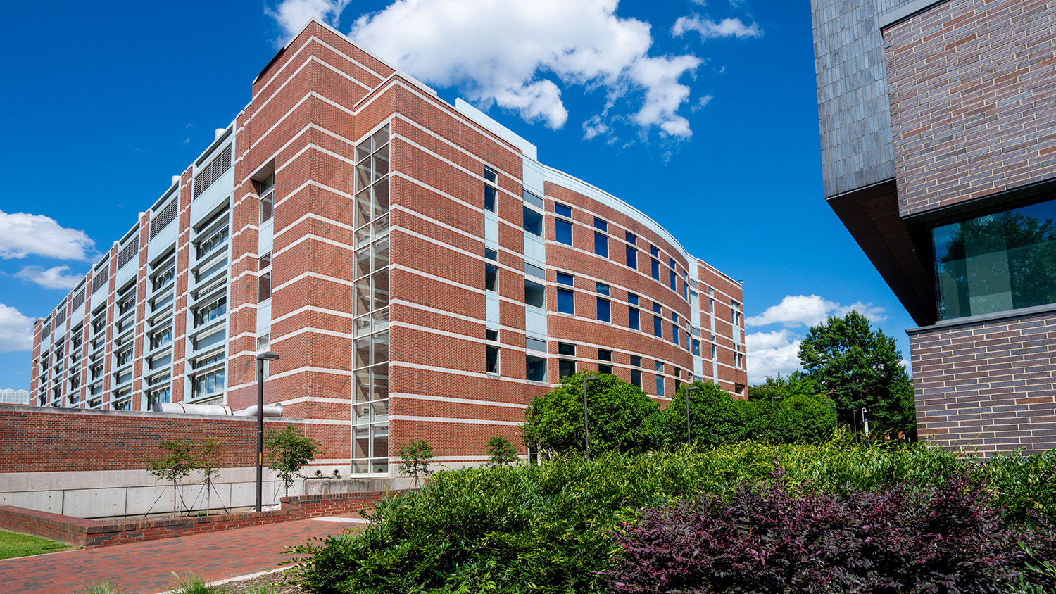 Engineering Building I and Fitts-Woolard (far right) from the Partners Way side of the buildings, on a sunny summer afternoon.